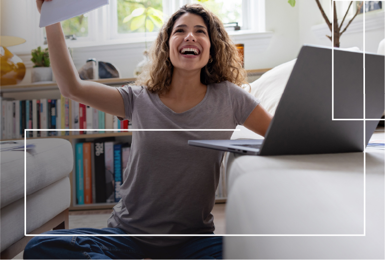 Lady smiling next to laptop