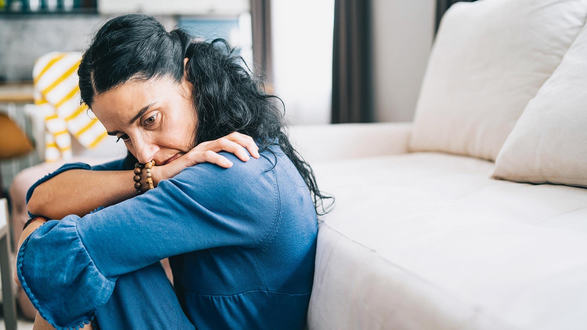Depressive middle age woman at home