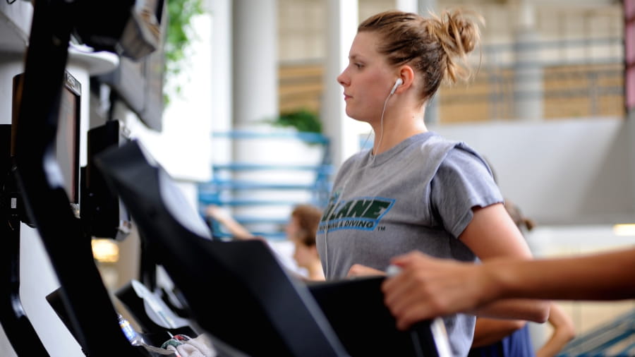 Woman working out on a treadmill.