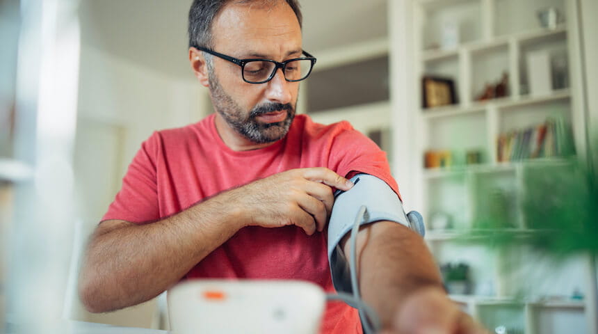 Man taking his own blood pressure