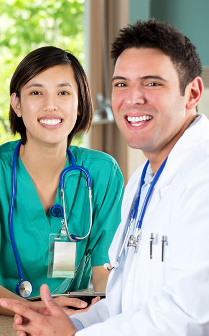 Medical practice staff smiling