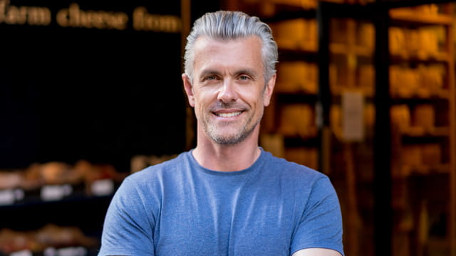 Man with gray hair smiling