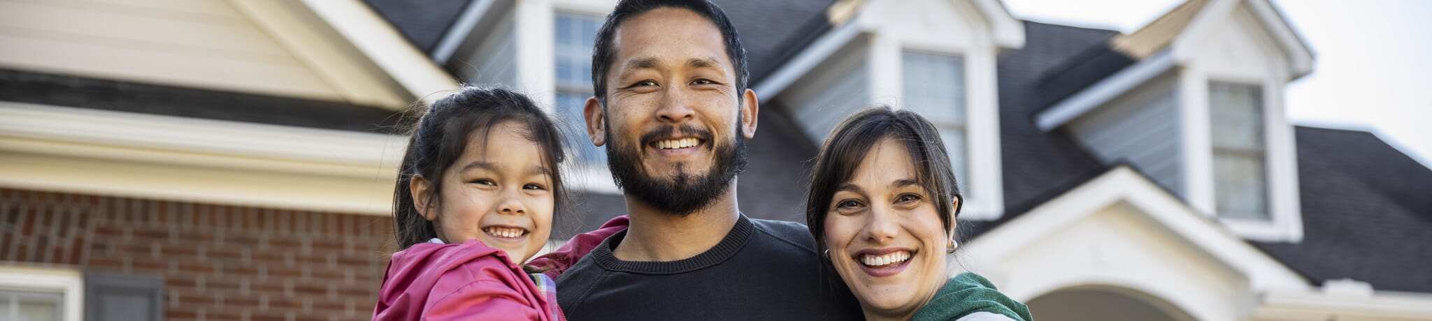 Family of three smiling