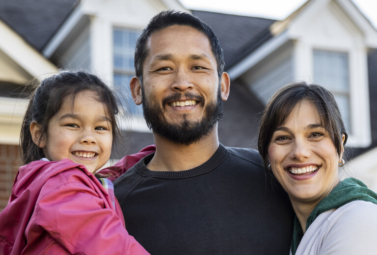 Family of three smiling