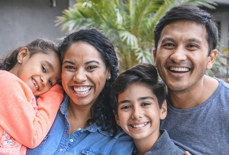 Family of four smiling