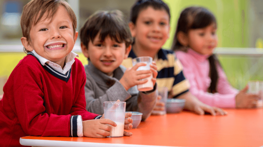 4 kids drinking milk