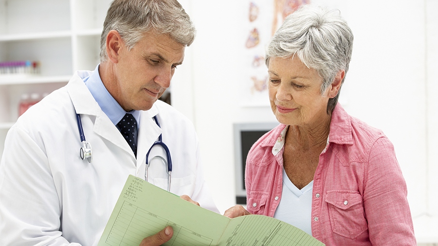 Elderly patient meeting with physician 