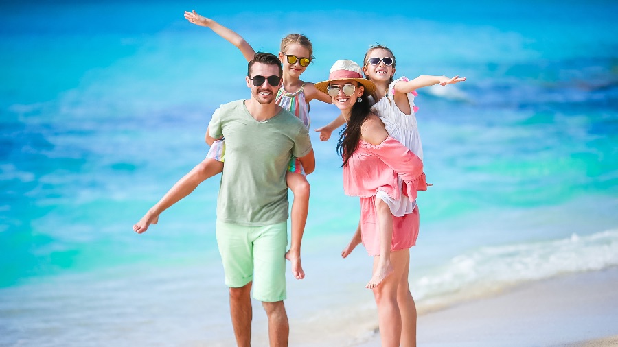 Family playing on the beach