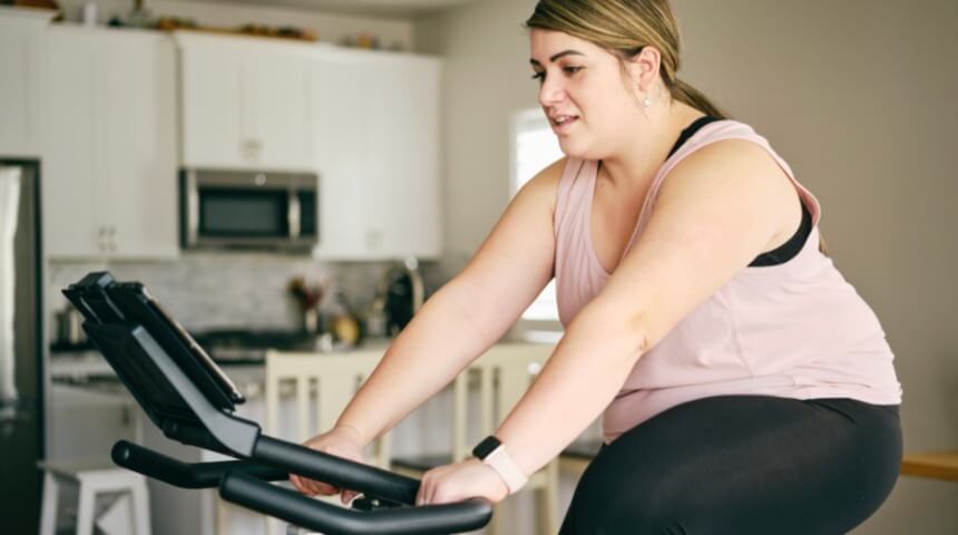 Lady on stationary bike