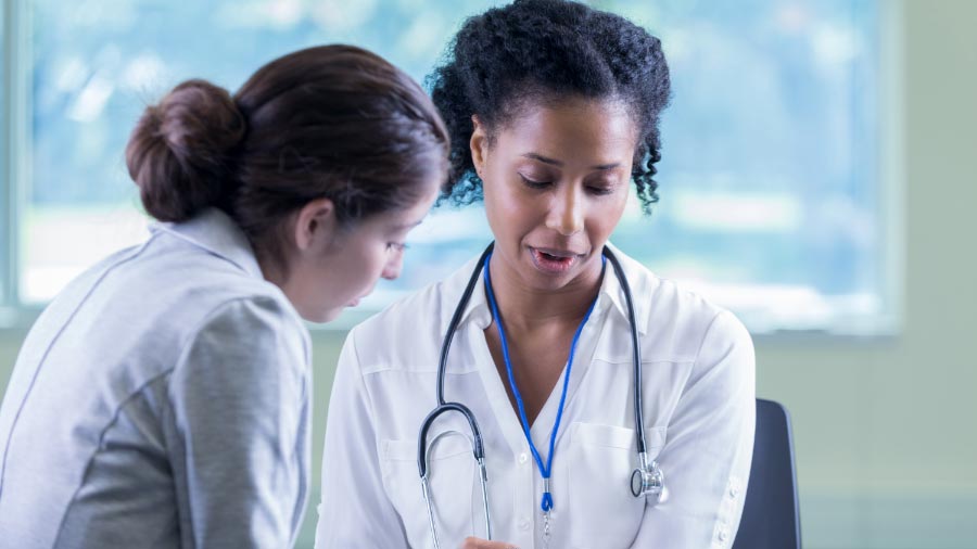 Female doctor explaining result to female patient