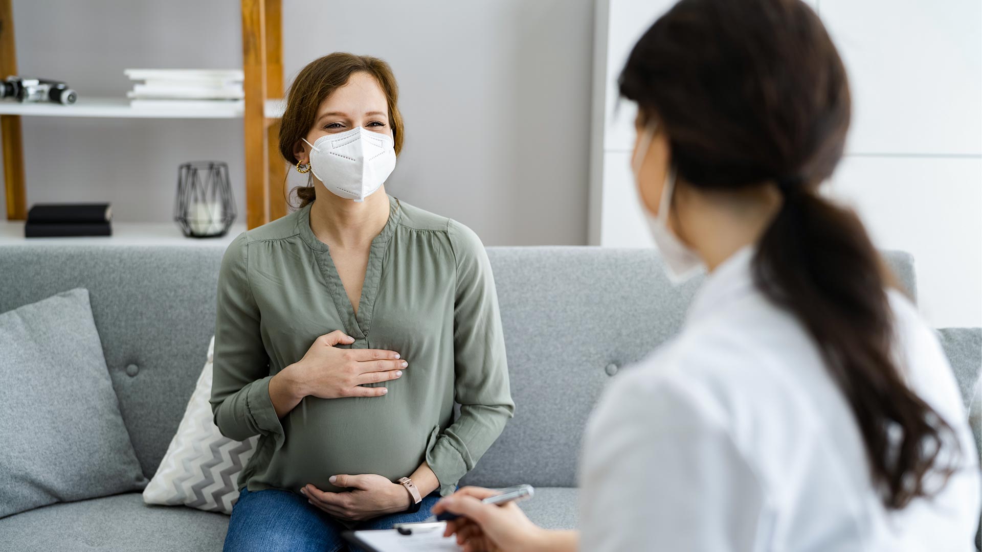Pregnant woman talking to a doctor