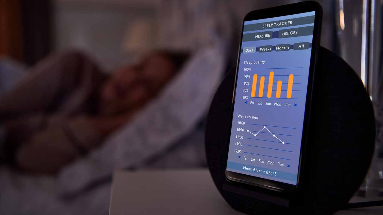 Sleep tracking app open on womans nightstand