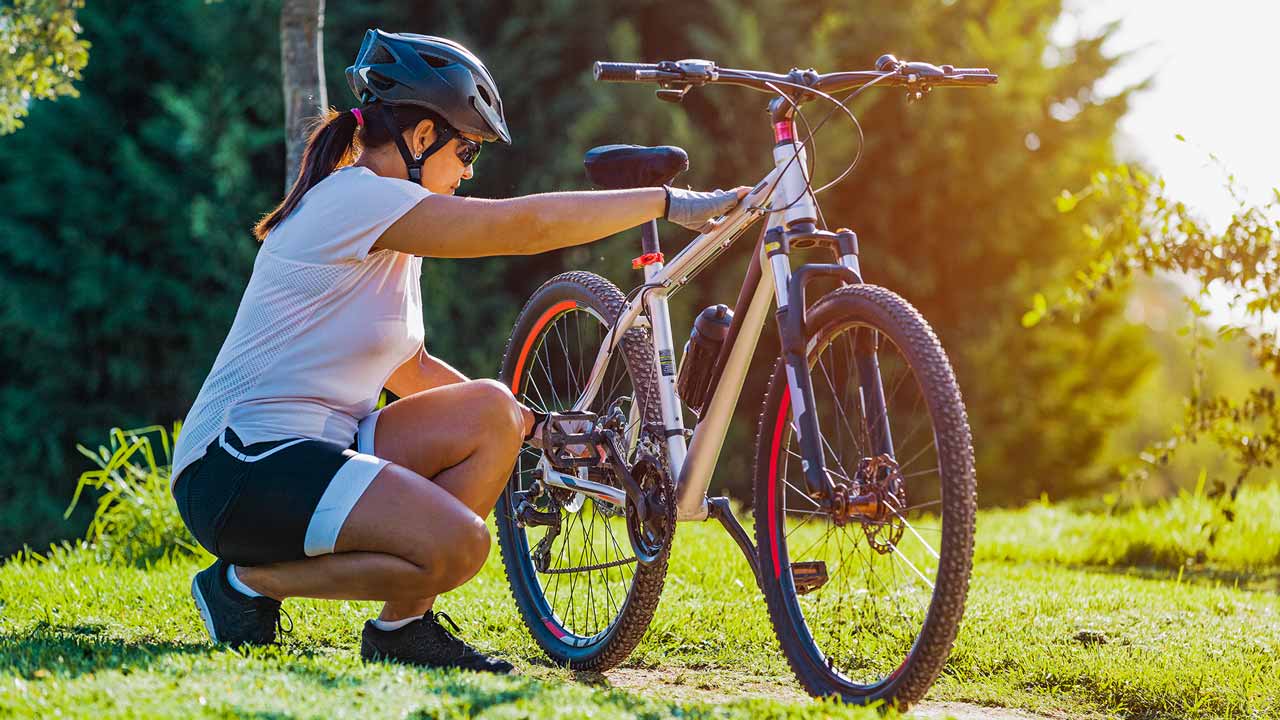 woman checking her bike