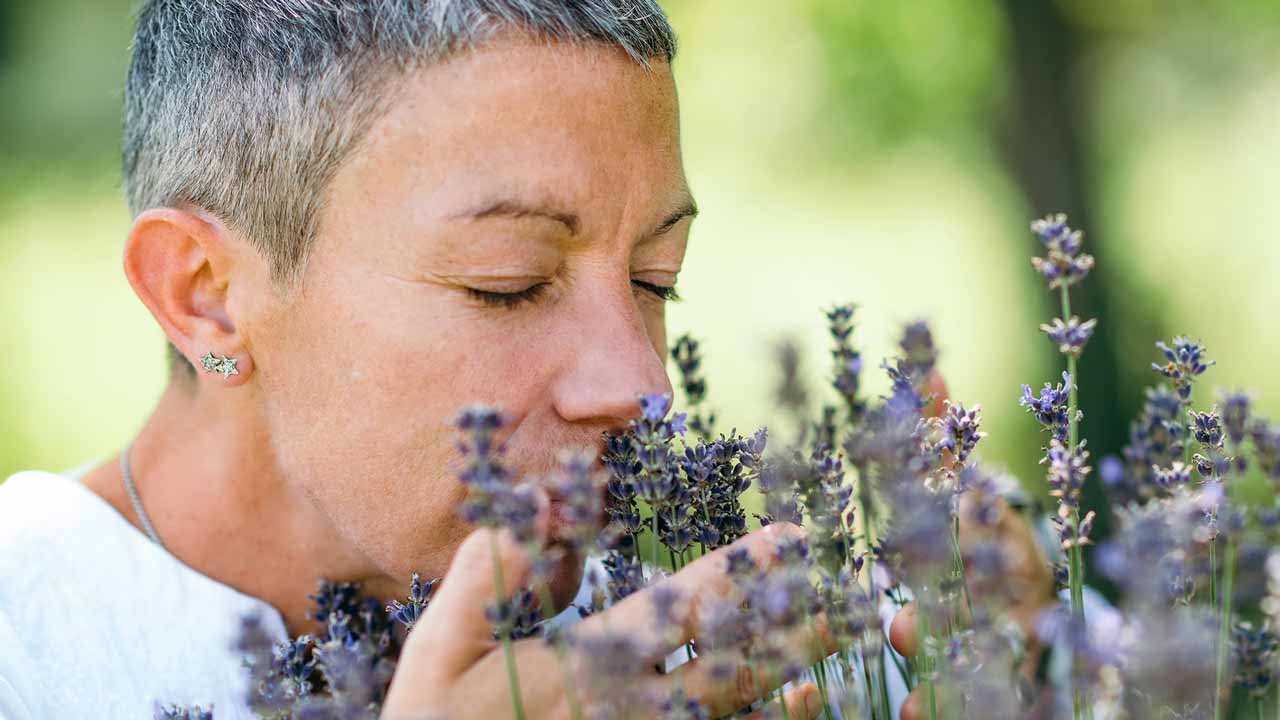 woman smelling flowers