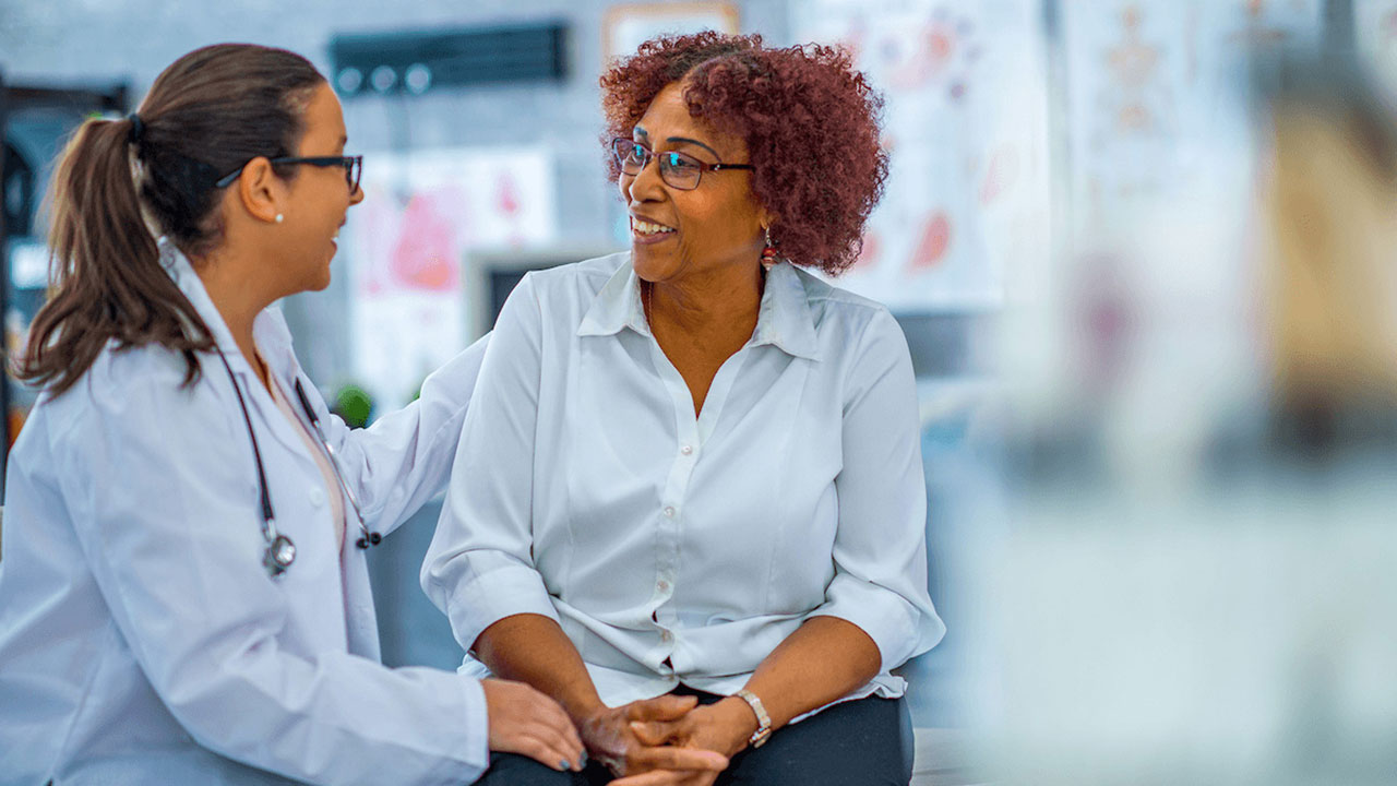 woman speaking to doctor