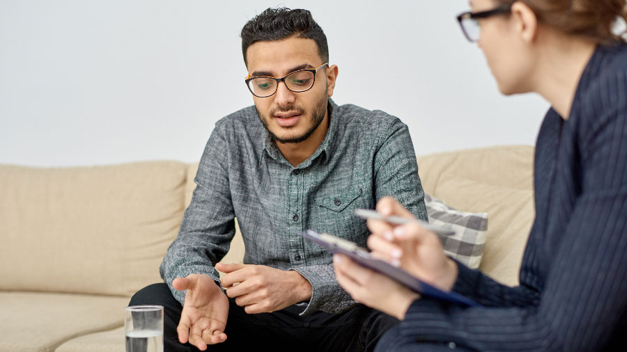 Young man sitting in therapy