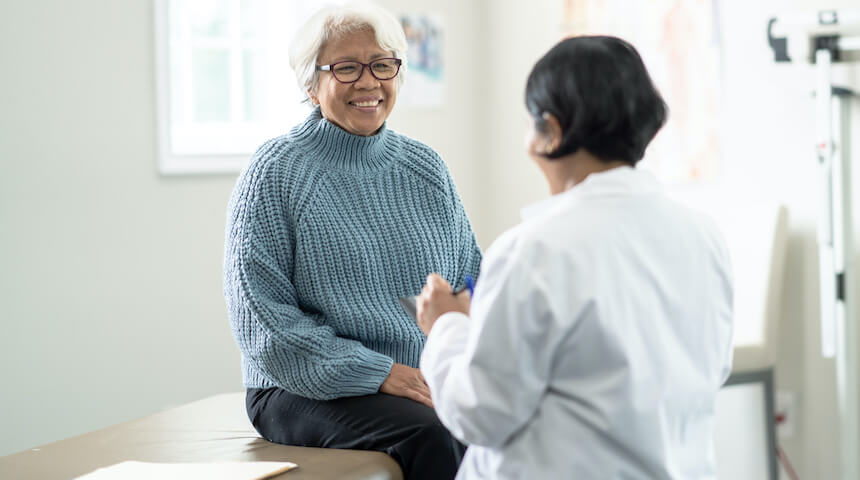 Woman speaking with doctor