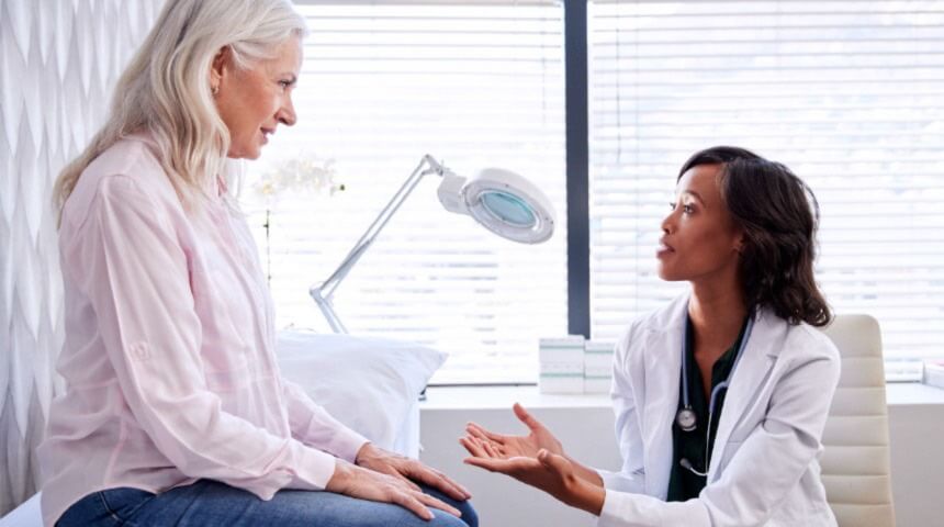 Lady talking to doctor