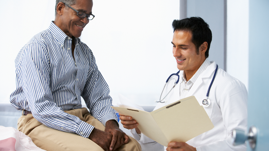 Male patient speaking to doctor about potential treatment options for prostate cancer.