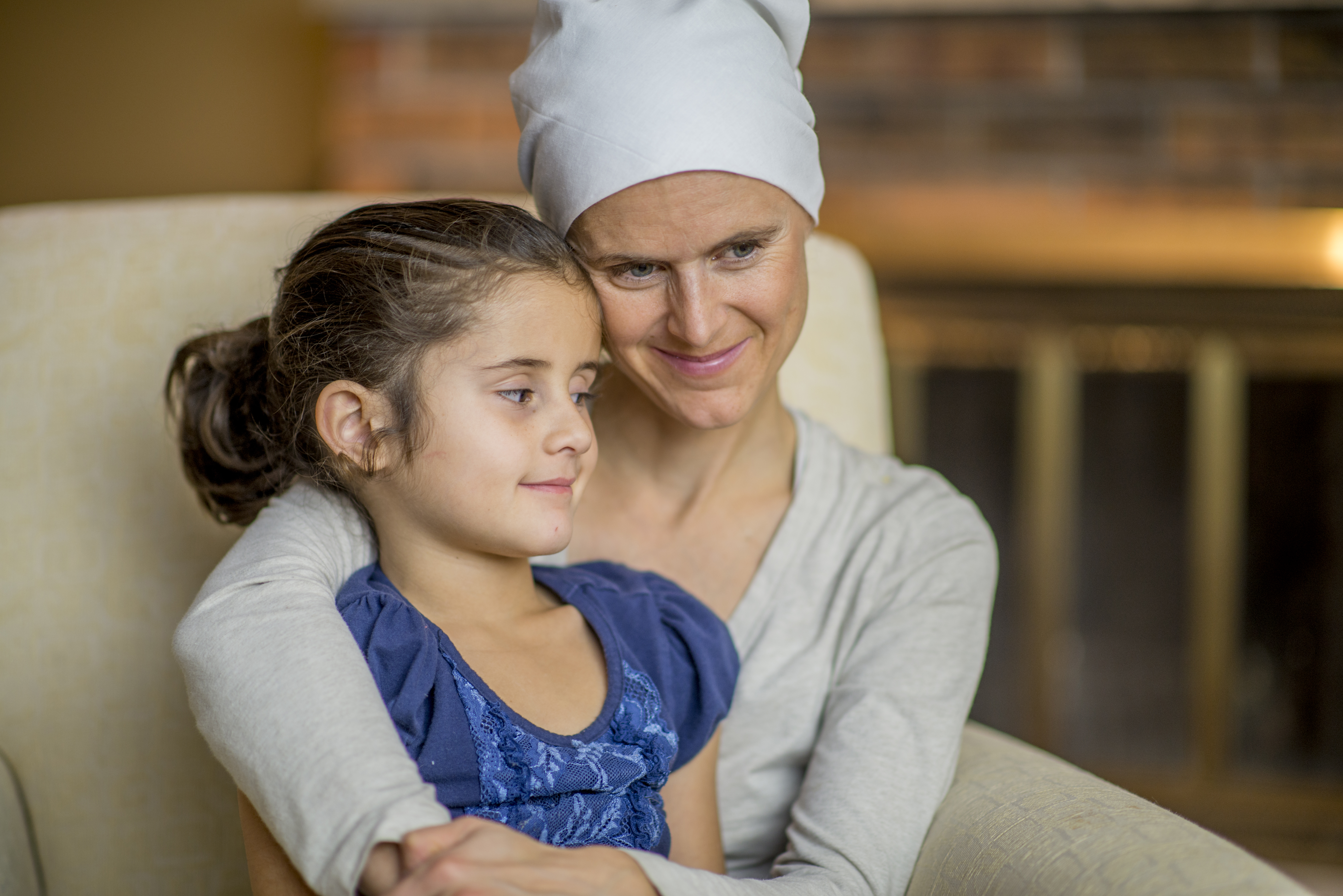 Breast cancer patient embracing child.