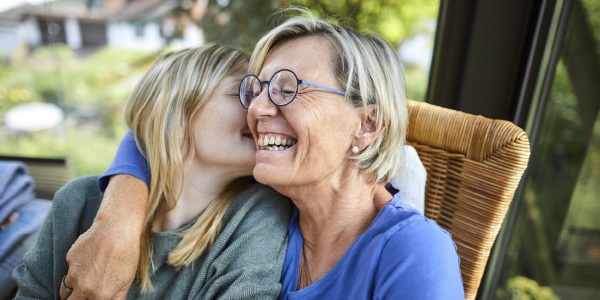 mom and daughter embracing