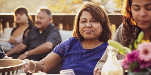 woman at a family gathering dinner table