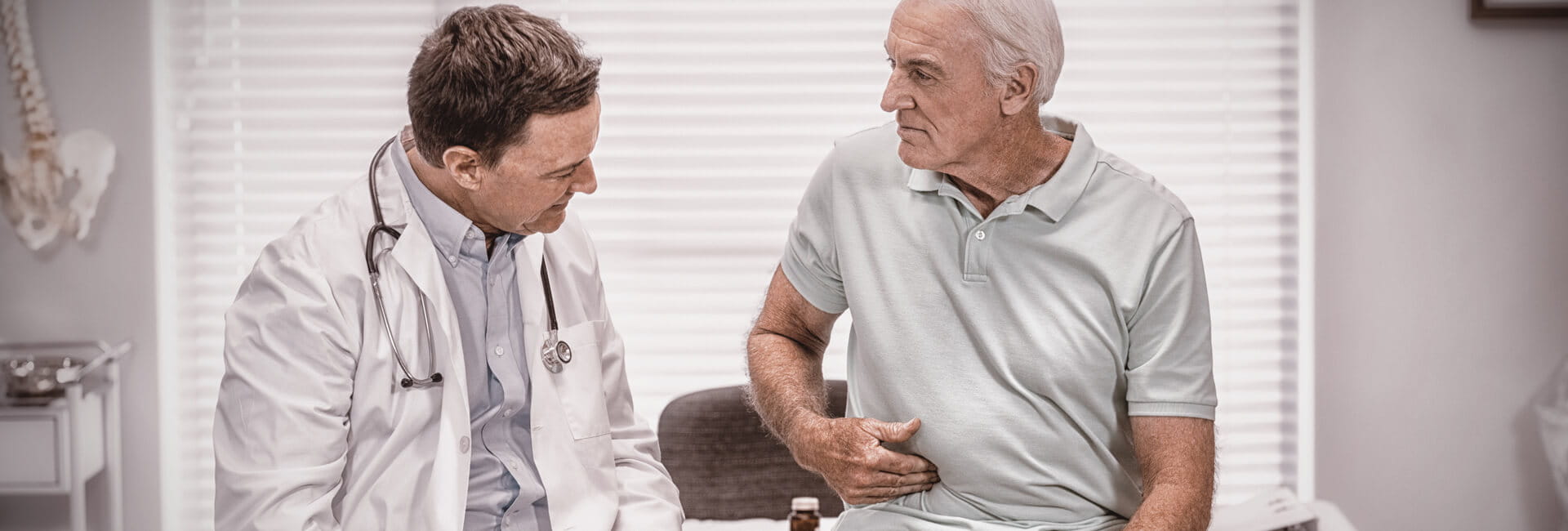 Doctor checking patient with gray hair