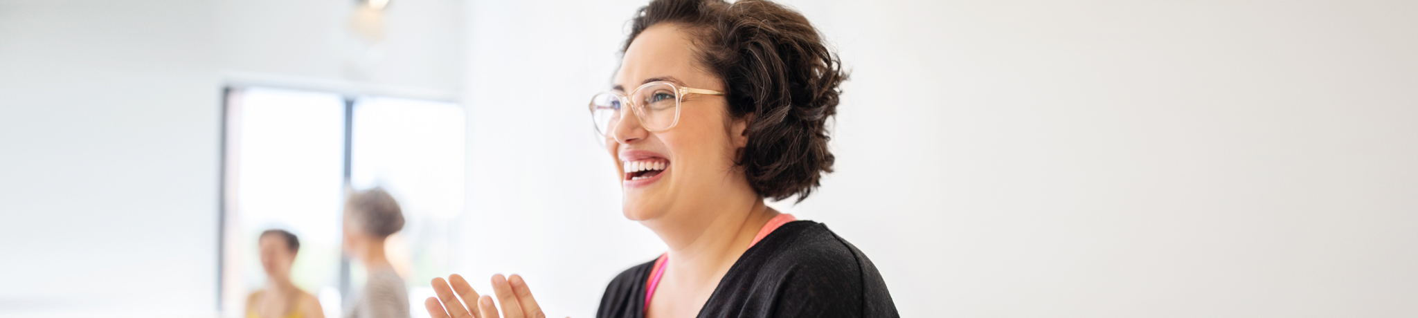 woman smiling in white room