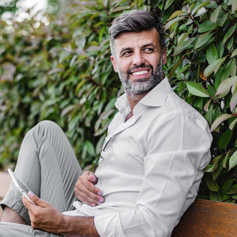 man sitting outdoors on a bench