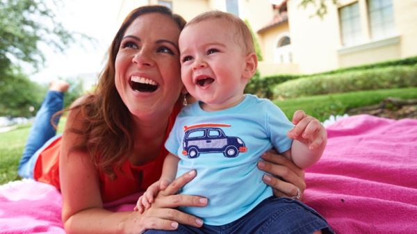 Mother and baby laughing