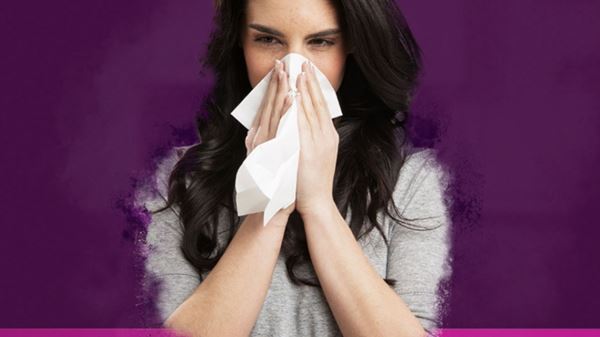 woman blowing nose