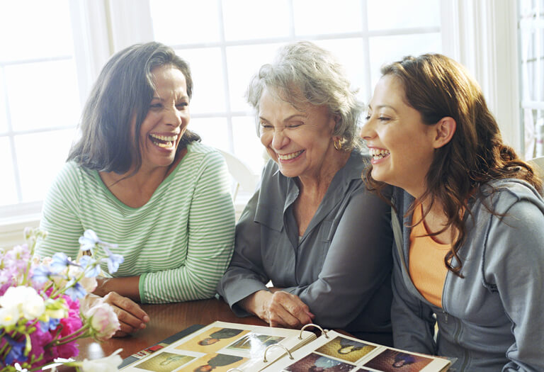 three women laughing