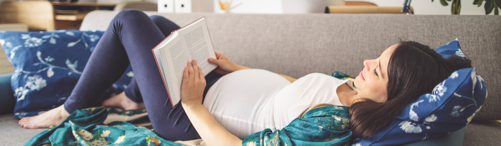 pregnant woman reading a book