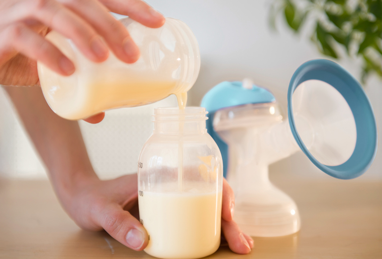 2 women walking in park