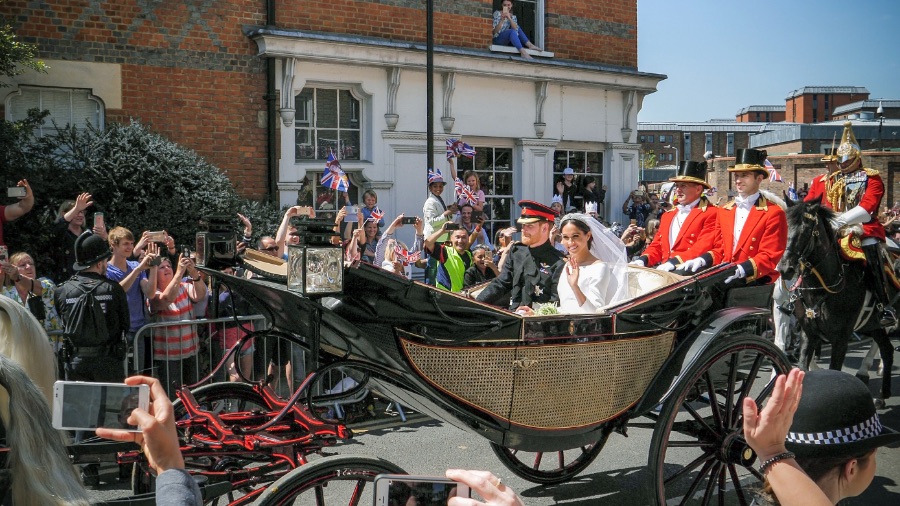 Prince Harry and Meghan Markle in a carriage